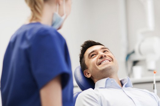 Patient in Black Forest smiling at dentist