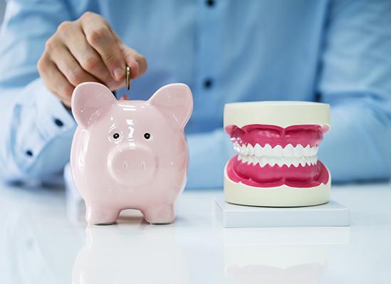 Patient in Colorado Springs discussing smile makeover cost with dental team